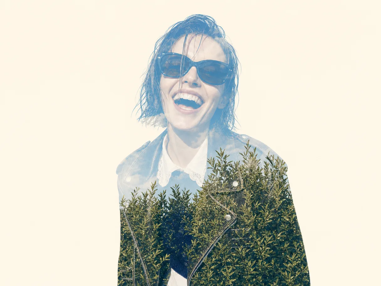 The same shot as a double exposure, foliage blended through the portrait